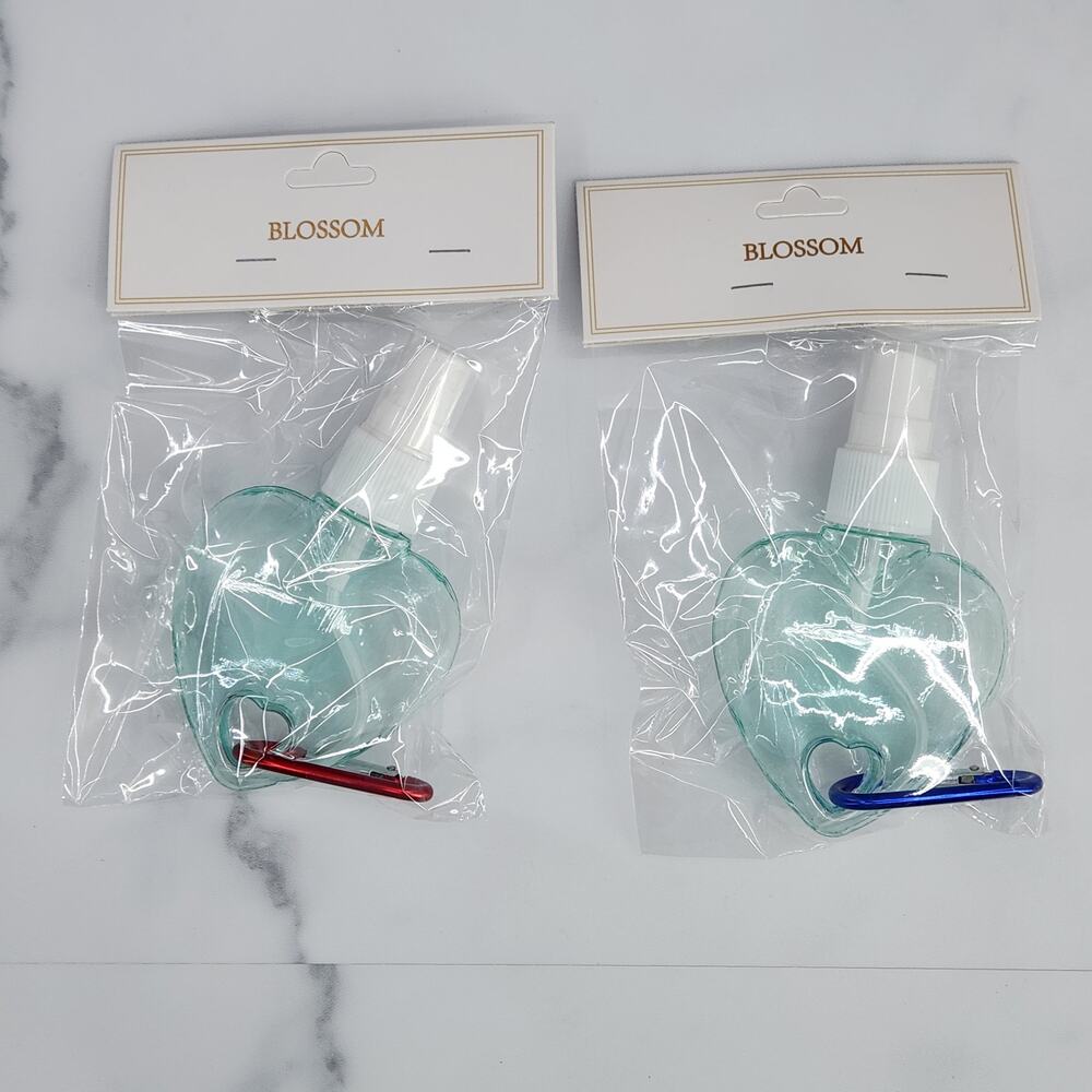 2 Heart Shaped Translucent Spray Bottles with a Carabiner - Light Sea Green